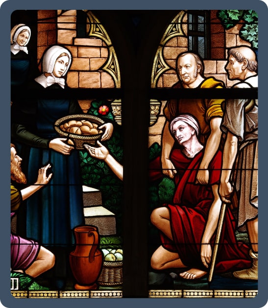 stain glass of a nun giving bread to poor people